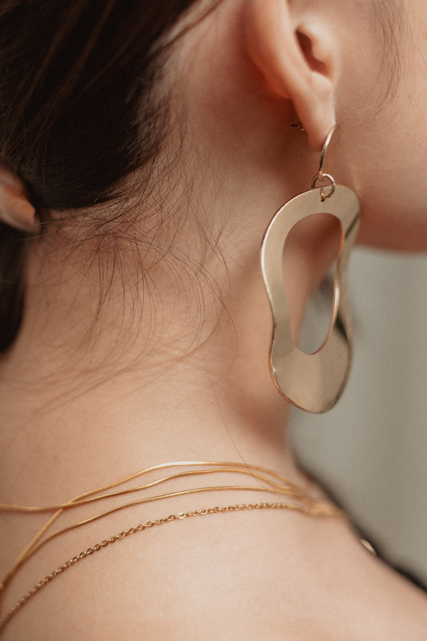 Closeup Portrait of a Woman Wearing Earrings and Necklace